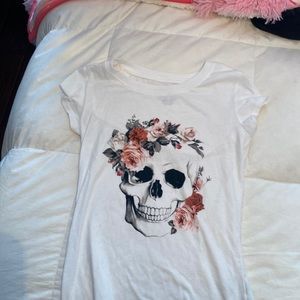 Girls size M shirt with skull and flowers.
